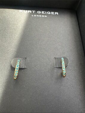 Kurt Geiger gold huggie earrings with blue crystals
